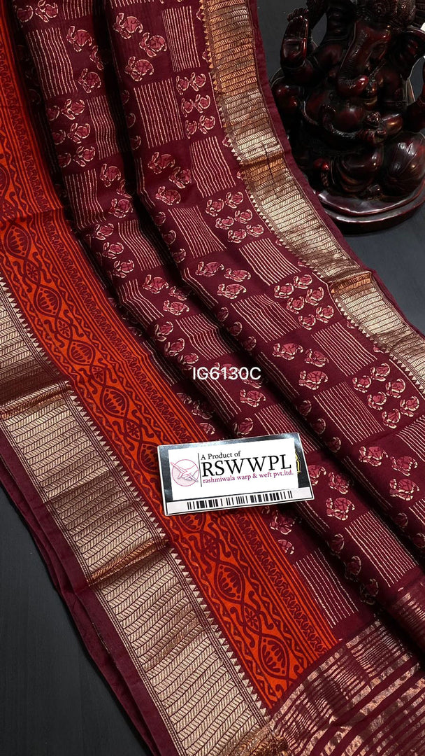 Red Elegant Maheswari print saree with intricate jari border weaving, a blend of tradition and contemporary grace.