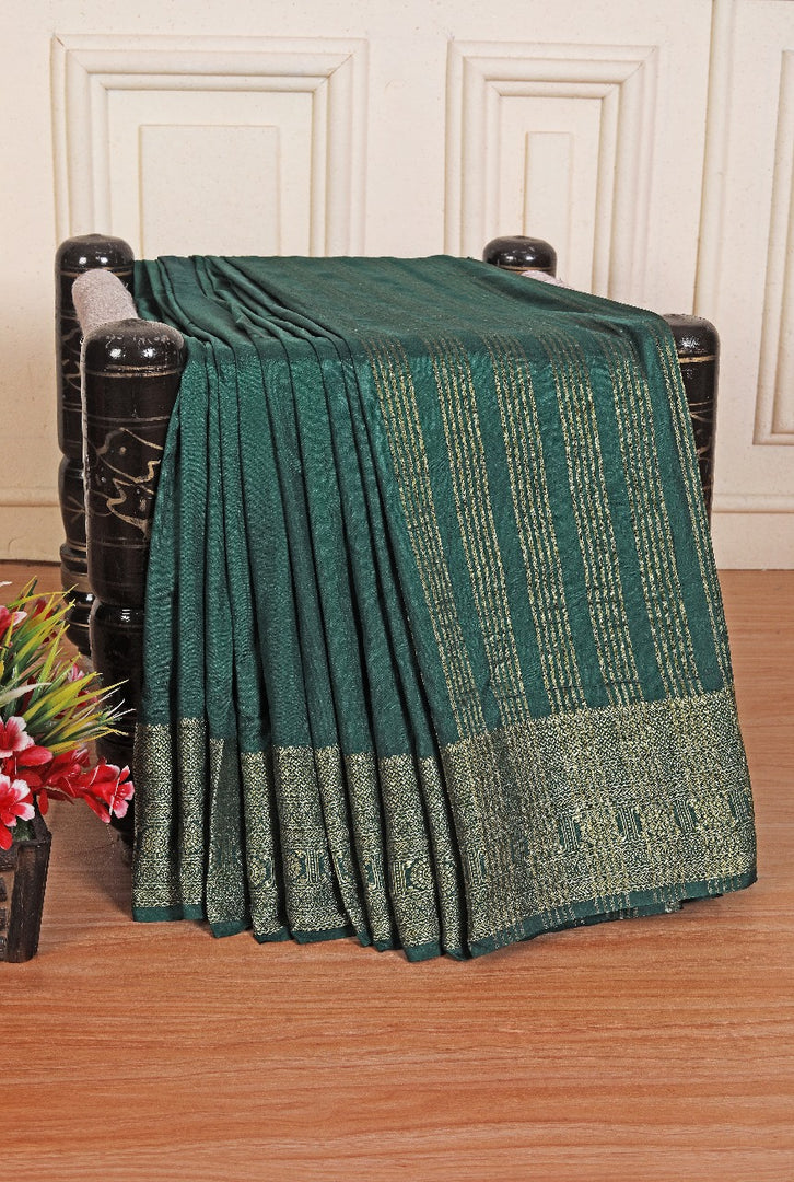 Crafted to shine designed to dazzle with this Botter green Crepe Mysore Silk Saree