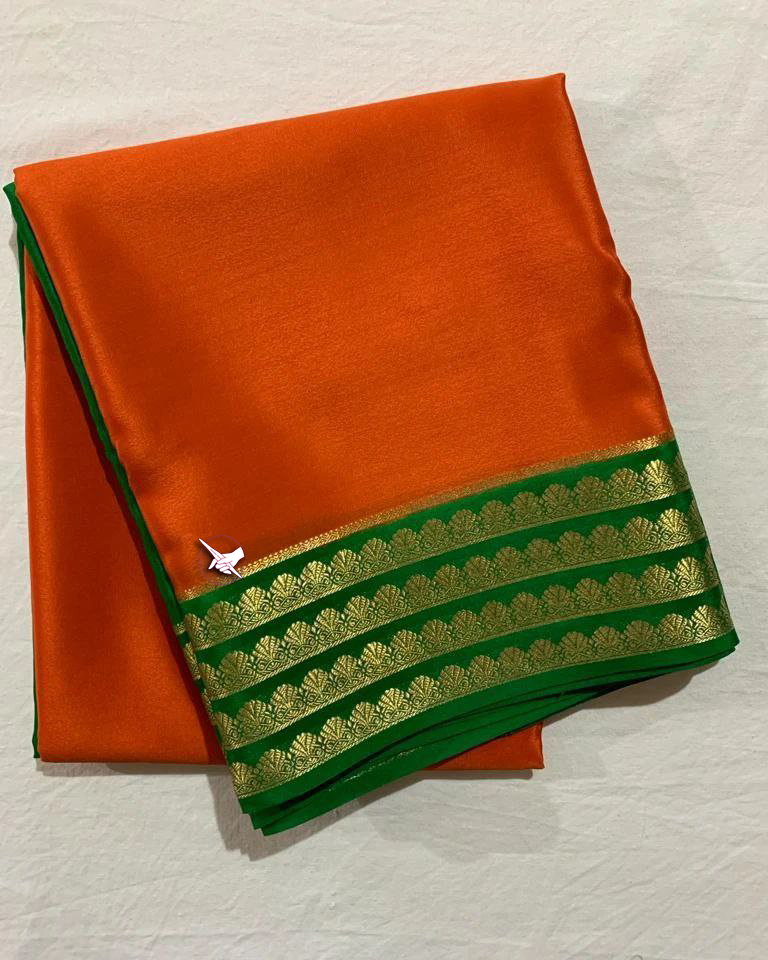 Exclusive Zari Border Orange nd Green Colour Plain Mysore Silk Saree.