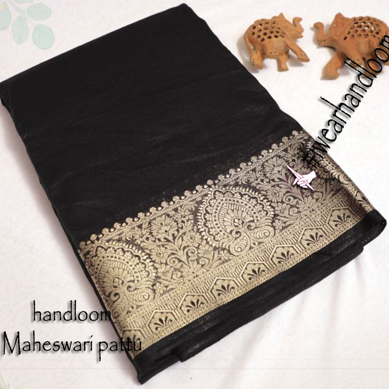 Black Glow Tissue Silk Saree With Elegant Weaving Accents