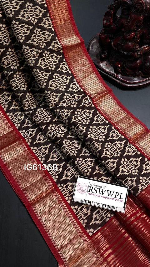 Black floral print saree with striking contrast border, elegant sophistication.