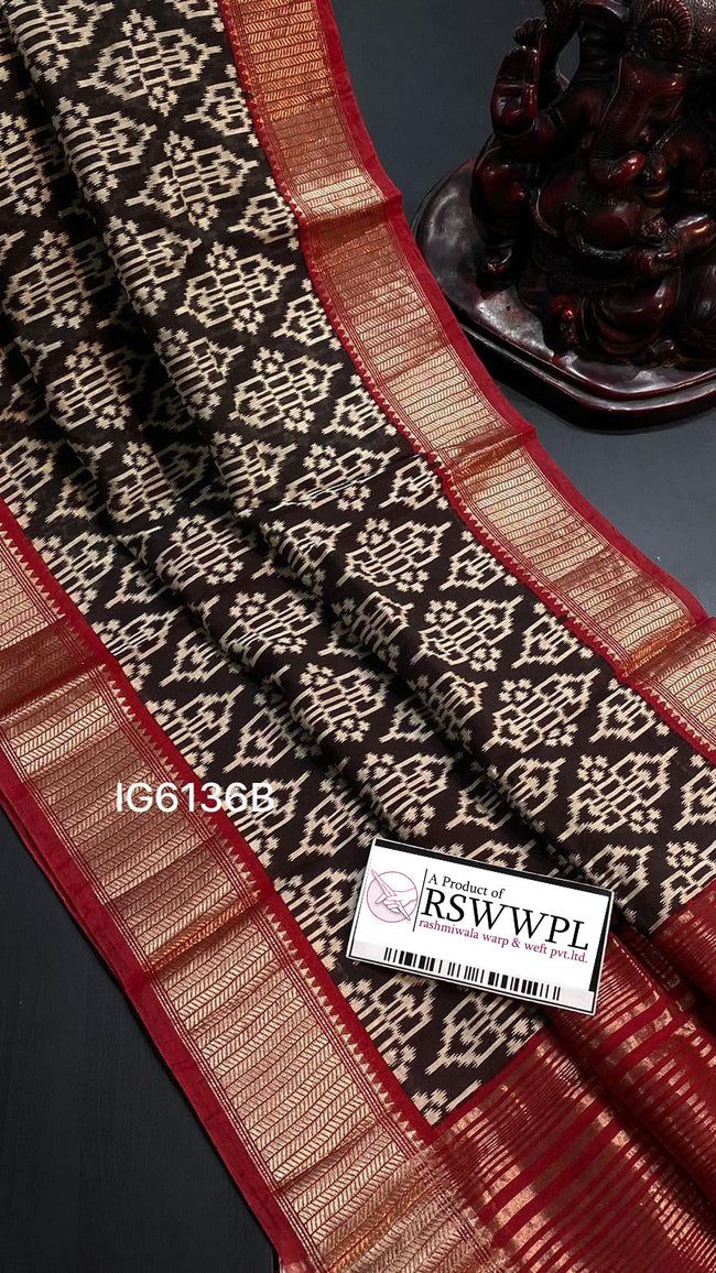 Black floral print saree with striking contrast border, elegant sophistication.