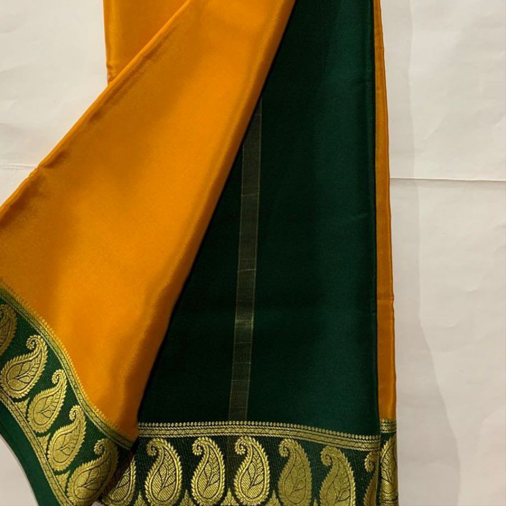 Exclusive Zari Border Orange Colour Plain Mysore Silk Saree.