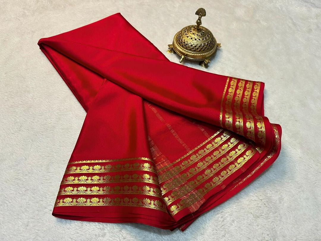 Exclusive Zari Border Orange   Plain Mysore Silk Saree.