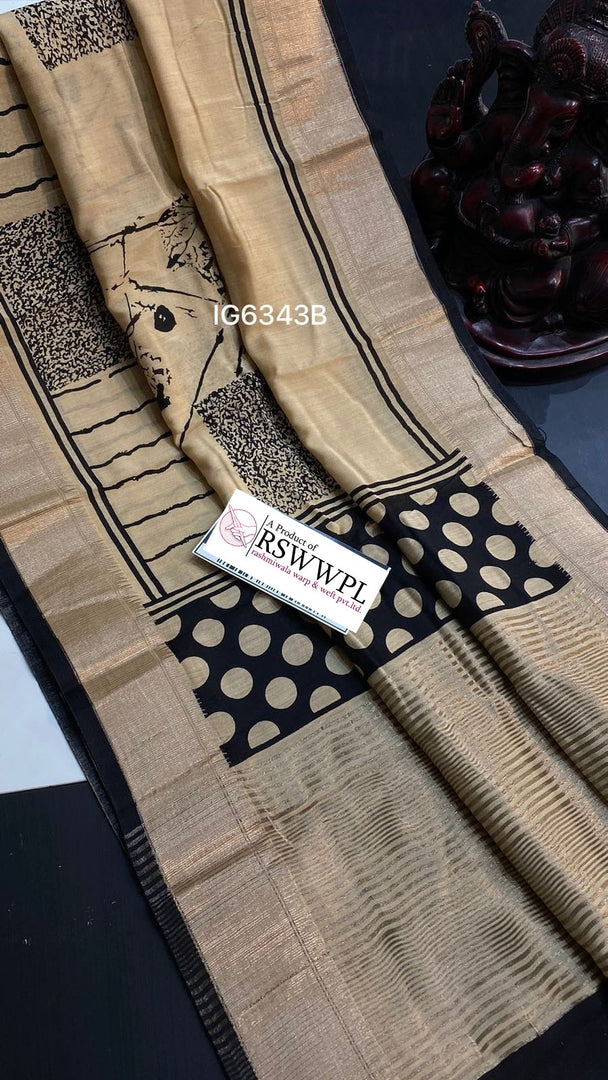 Light Brown  Lightweight, soft Assam silk with woven border and beautiful prints.