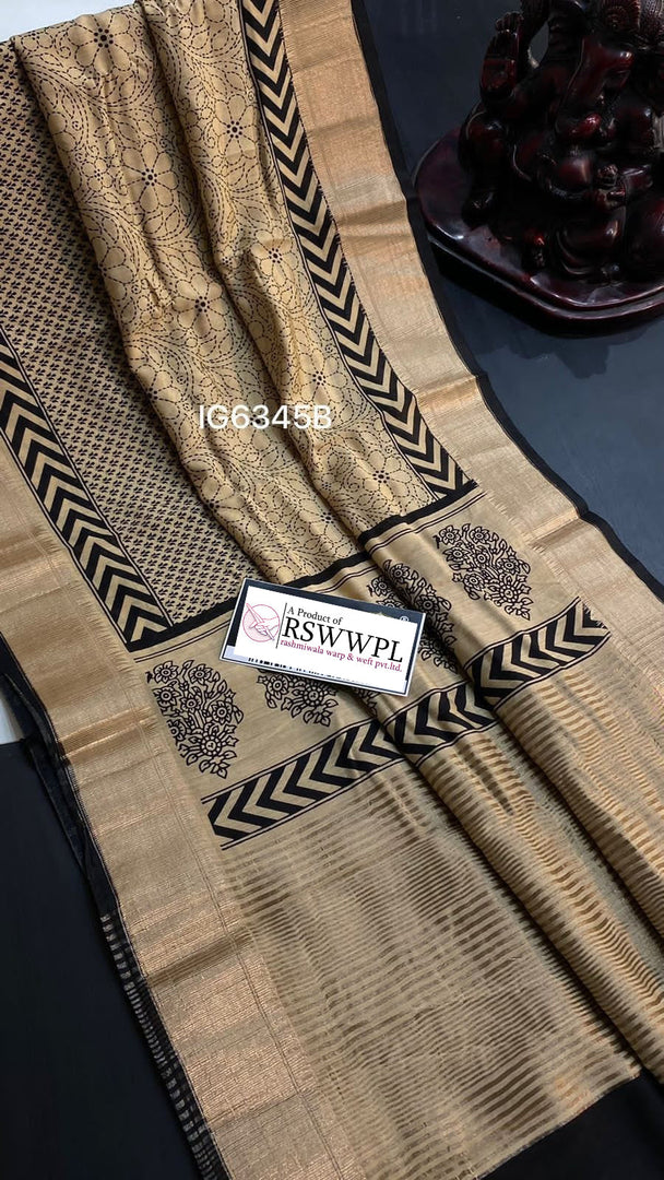 Light Brown  Lightweight, soft Assam silk with woven border and beautiful prints.