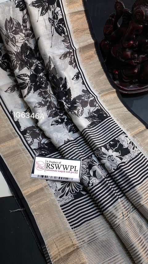 White nd Black  Lightweight, soft Assam silk with woven border and beautiful prints.