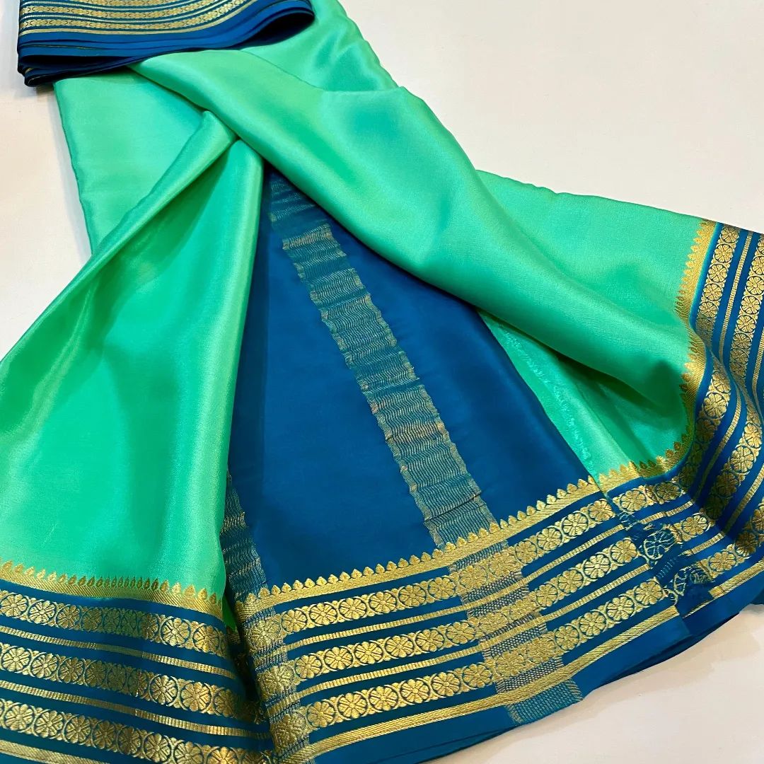 Exclusive Zari Border Sky Blue nd Green Colour Plain Mysore Silk Saree.