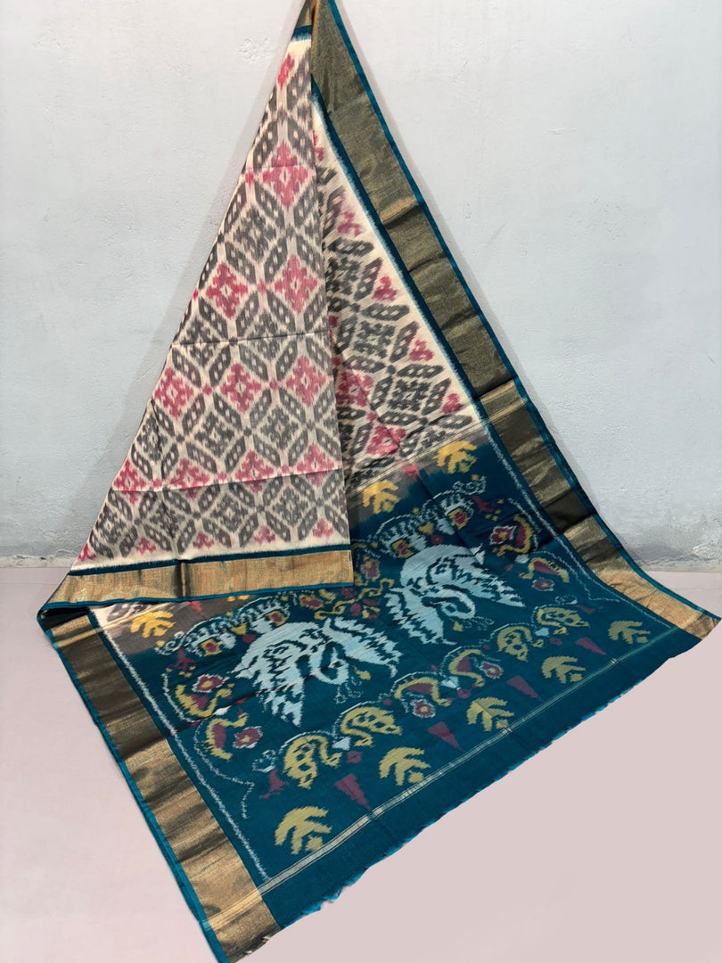 Feminine finesse in every fold of this Pure ikkat Silk saree