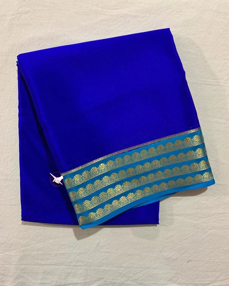 Exclusive  Zari Border Blue nd Green nColour Plain Mysore Silk Saree.