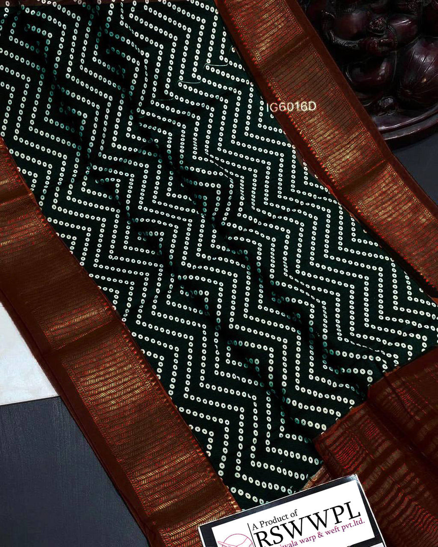 Black Lightweight, soft Assam silk with woven border and beautiful prints.