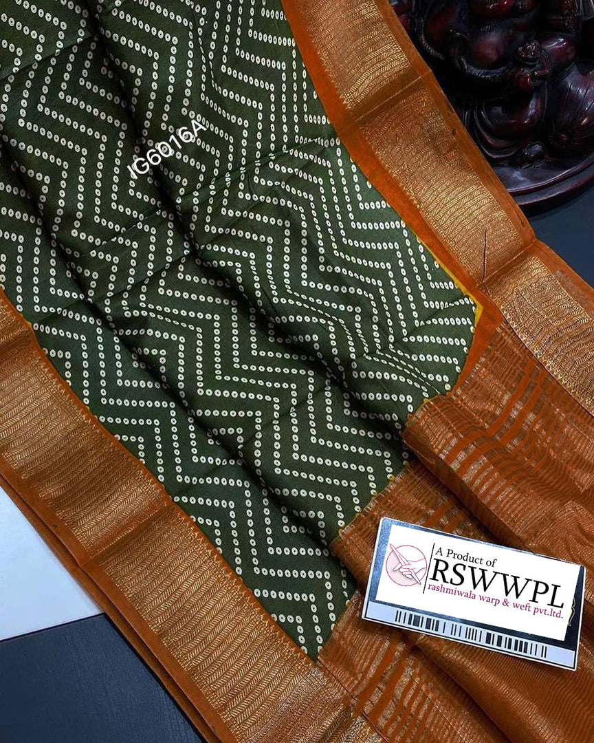 Green Lightweight, soft Assam silk with woven border and beautiful prints.